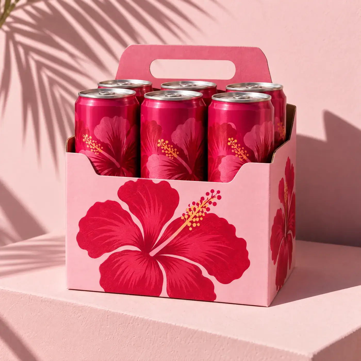 Hibisco concept: a pink six-pack carrier printed with a hibiscus flower holding magenta cans. Sample image created by Quiamo, a brand, marketing and media agency from India.