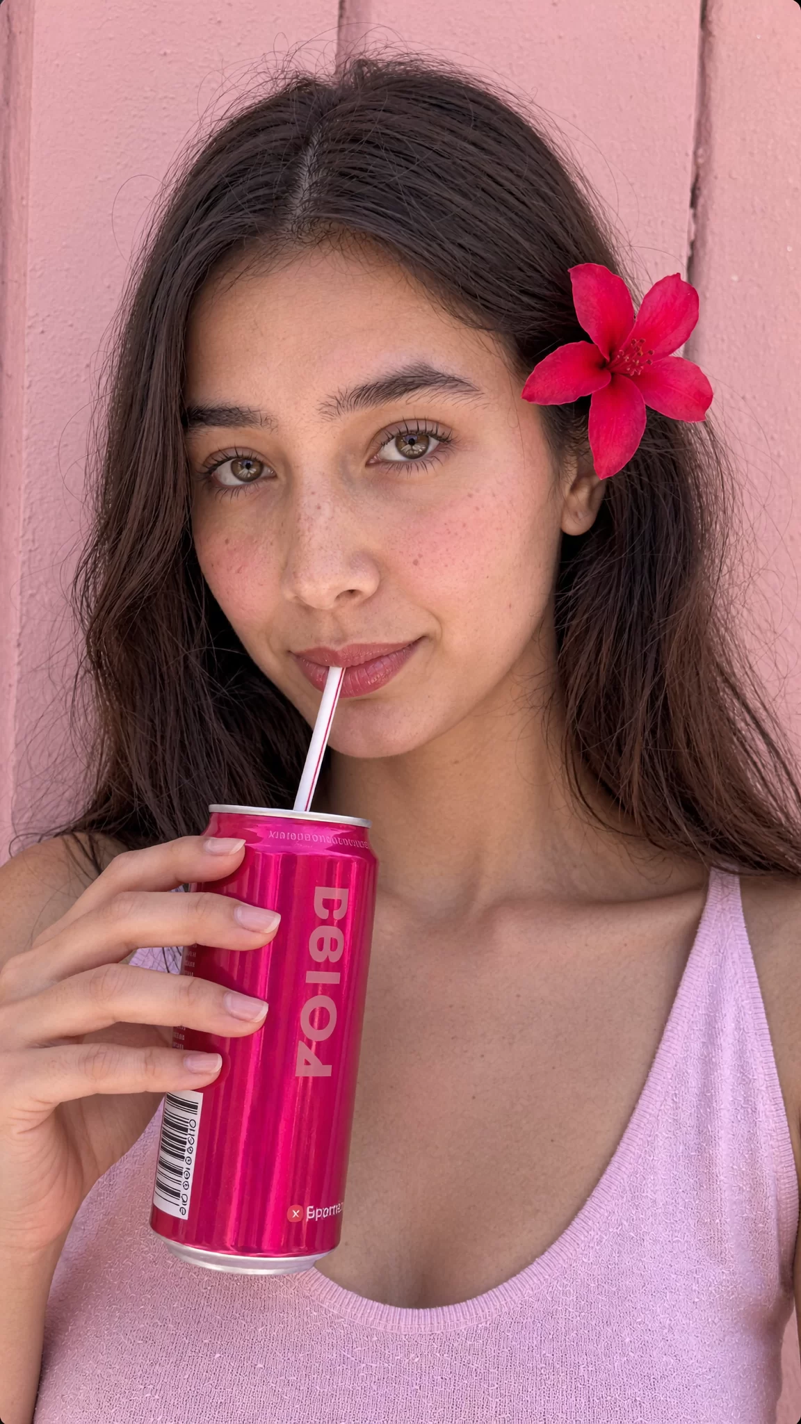 Quiamo | Kunal Waghmare Hibisco concept social portrait: AI character Dhwaja sipping from a magenta can with a hibiscus flower behind her ear. Sample image created by Quiamo, a brand, marketing and media agency from India.